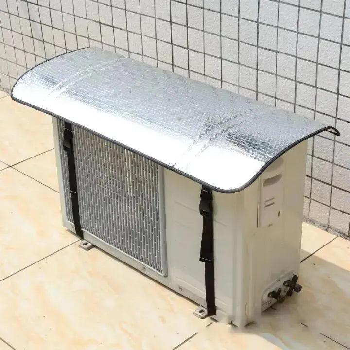 Weatherproof AC outer shade cover installed above an outdoor air conditioner unit to protect it from sun, rain, and harsh weather.
