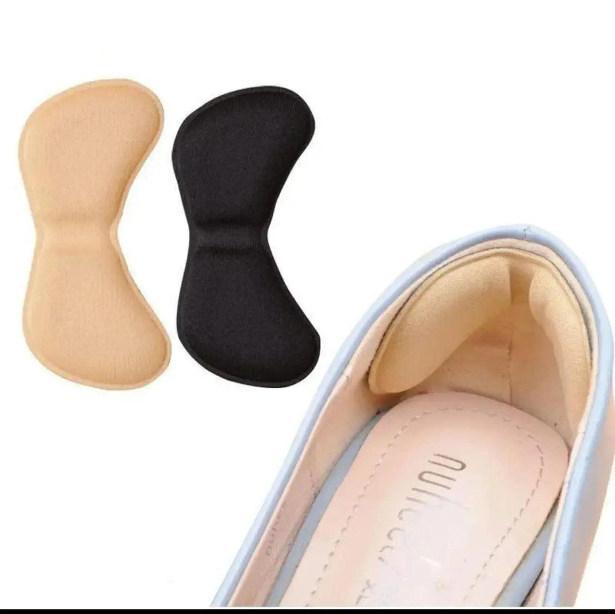Beige and black padded heel inserts shown beside a shoe, designed to cushion the heel and help prevent slipping.