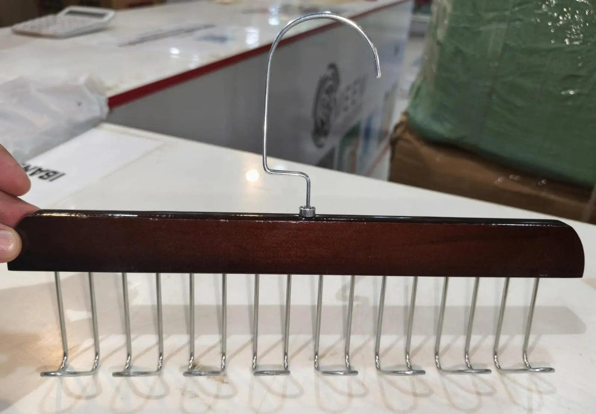 Dark wooden wardrobe hanger with multiple metal hooks for organizing clothes, scarves, belts, and accessories.