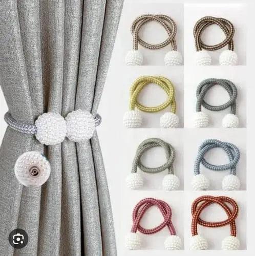 Adjustable braided curtain tieback cords with white beaded ends, shown in multiple colors and used to hold back grey curtains.