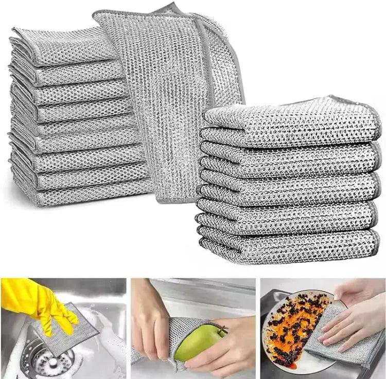 Stainless steel mesh cleaning cloth scrubbing a pot to remove burnt food and stubborn grease without wearing out.