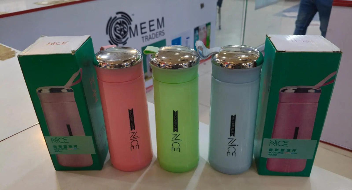 Pink, green, and blue Nice 400ml travel water bottles with silver lids, carry straps, and retail packaging.