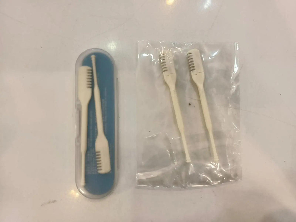 Manual nose hair razor in a protective case with two additional grooming and cleaning tools.