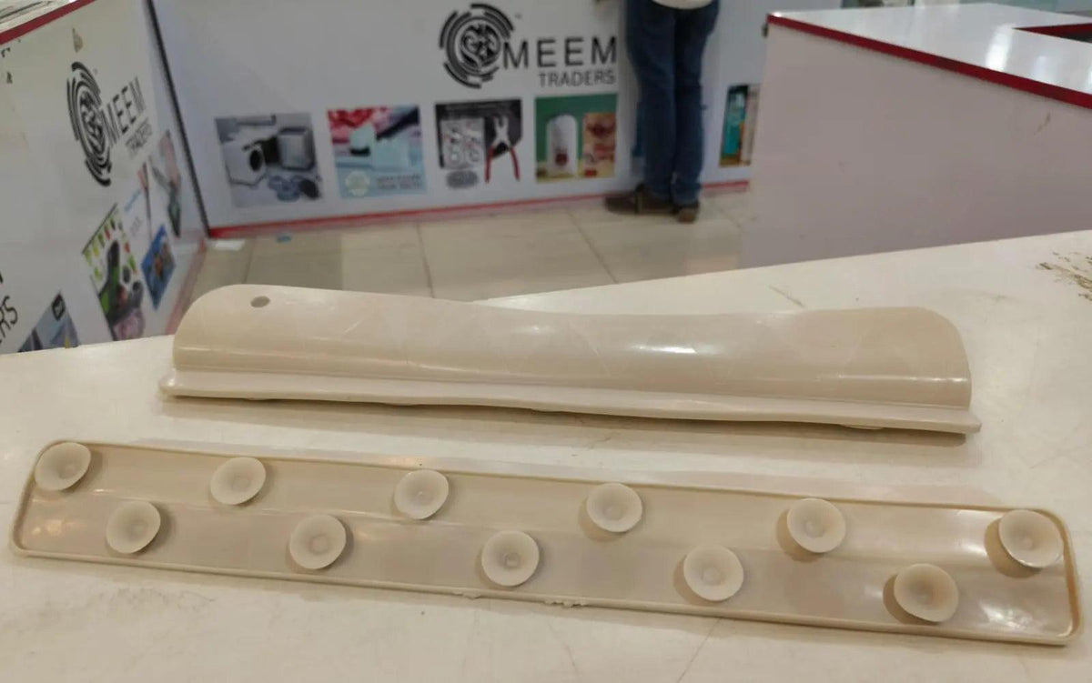 Beige silicone kitchen sink splash guard shown from the front and back, featuring multiple suction cups for secure attachment.