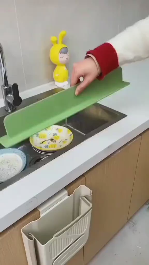 Video demonstrating a silicone sink splash guard that keeps countertops dry, prevents water splashes, and fits around kitchen or bathroom faucets for easy cleaning and organization.