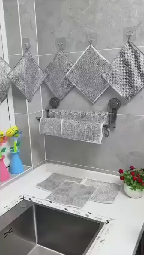 Video showing reusable stainless steel mesh wire cleaning cloths cleaning pots, pans, sinks, and kitchen surfaces effectively.