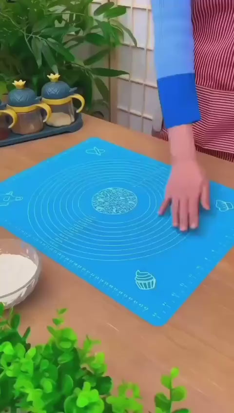 Video demonstrating a non-stick silicone dough rolling mat with measurement markings for rolling roti, chapati, pizza, and pastry dough. Easy-to-clean, reusable baking accessory for home kitchens.